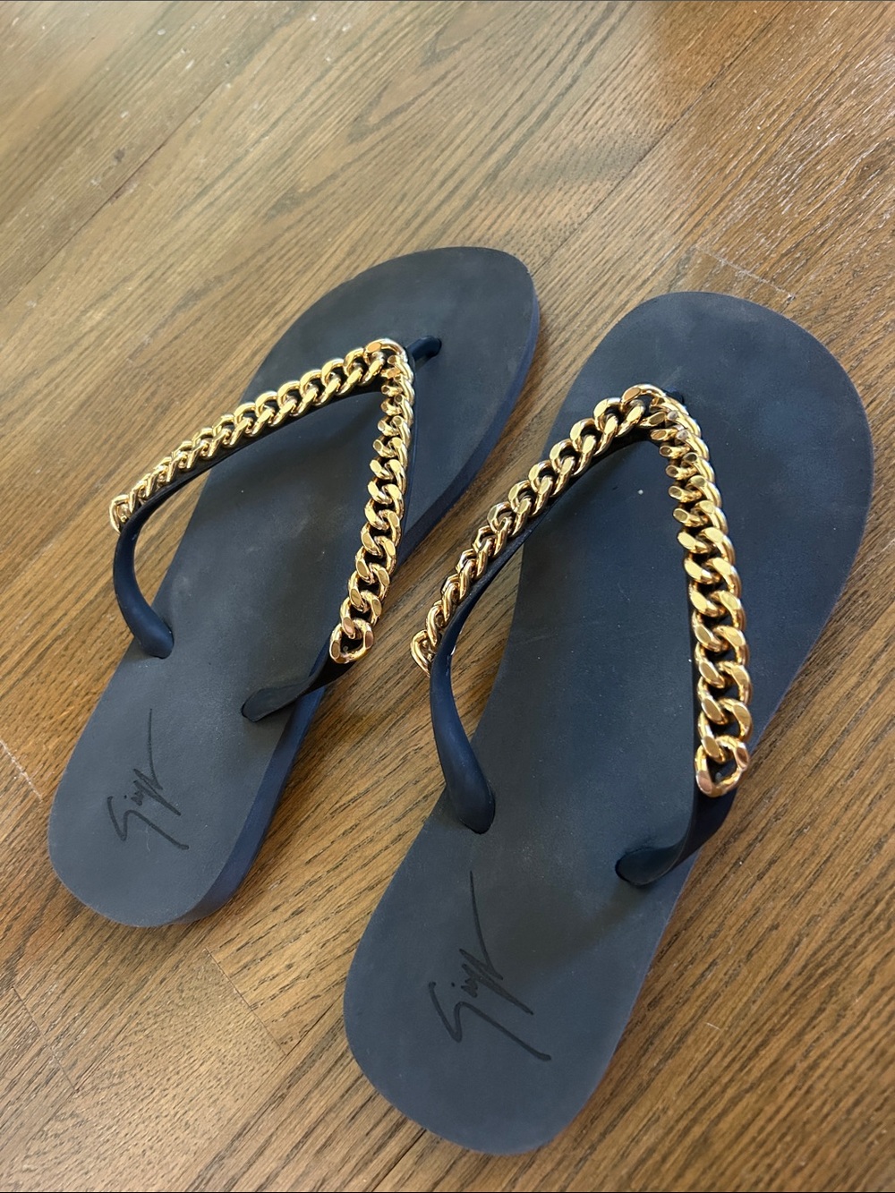 Giuseppe Zanotti Black Flip-Flop Sandals with Gold Chain Trim